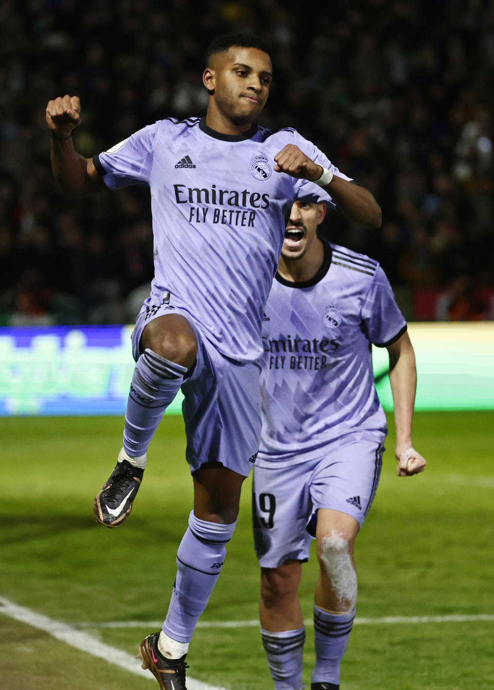 Real Madrid's Rodrygo, front, celebrates with Dani Ceballos after scoring the opening goal during a Spanish Copa del Rey round of 32 soccer match between Cacereno and Real Madrid at the Principe Felipe stadium in Caceres, Spain, Tuesday Jan. 3, 2023. (AP Photo/Pablo Garcia)