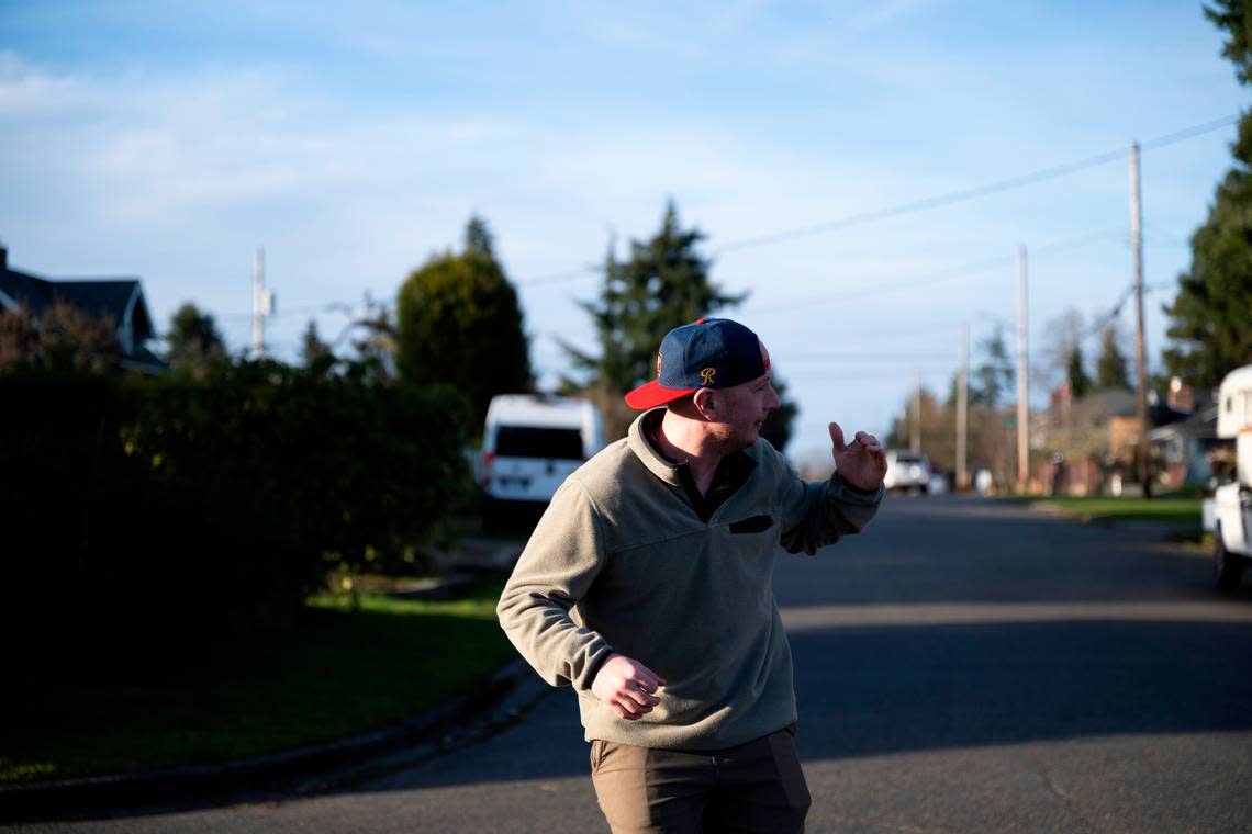 Kevin Larson reenacts the attack by a barred owl that he survived while going for a jog in the early morning hours of Dec. 13, 2023, in Tacoma, Wash. Brian Hayes/bhayes@thenewstribune.com