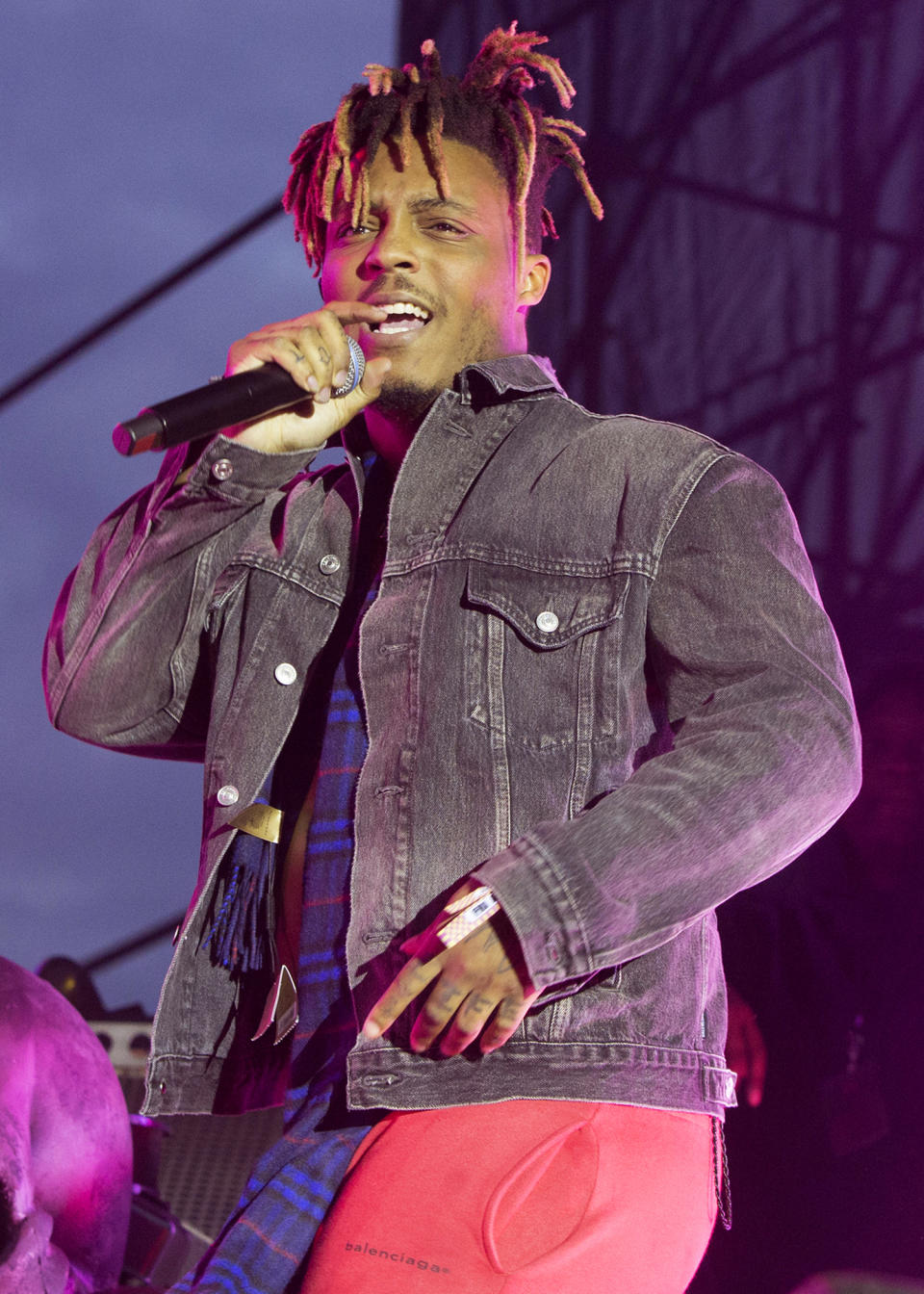 FILE - In this May 15, 2019 file photo, Juice WRLD performs in concert during his "Death Race for Love Tour" at The Skyline Stage at The Mann Center for the Performing Arts in Philadelphia. The 21-track album "Legends Never Die" set several records when it debuted at No. 1 on the Billboard 200 albums chart this week. With 497,000 equivalent albums sold, based on digital sales and streams, “Legends Never Die" marks the biggest posthumous debut in 23 years since Tupac and Notorious B.I.G. posthumously released albums in 1997. (Photo by Owen Sweeney/Invision/AP, File)