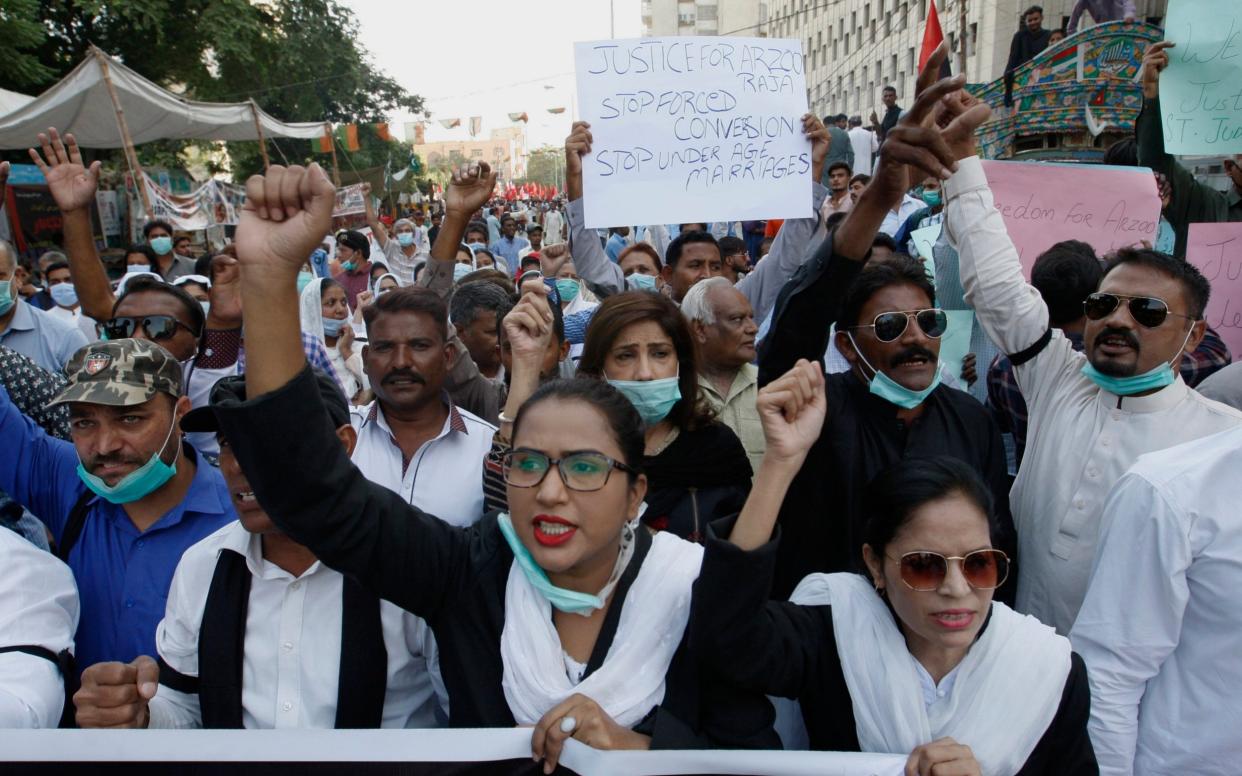 Pakistani Christians protest against child marriage and forced conversion, in Karachi - Fareed Khan/AP