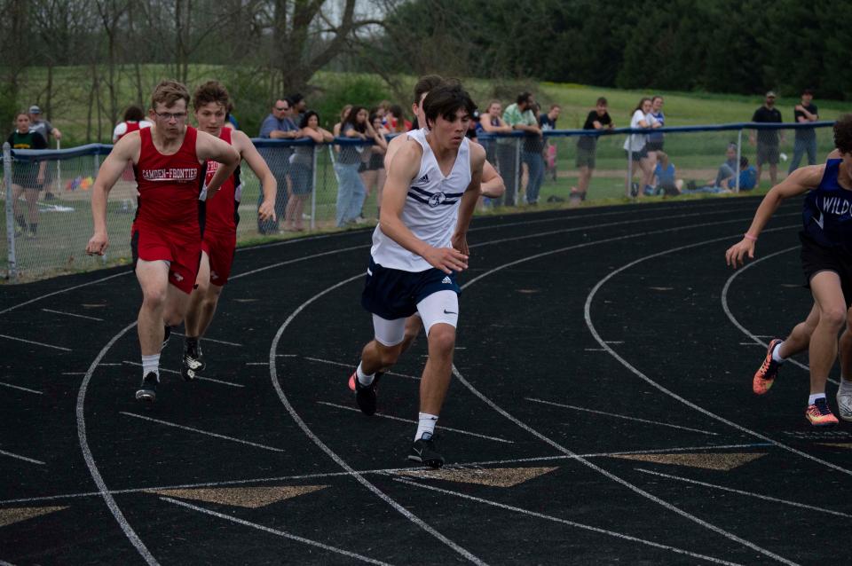 The 4x100 relay teams of Camden and Hillsdale Academy attempt to catch up with Pittsford and Lenawee Christian.