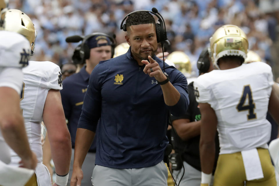 Notre Dame head coach Marcus Freeman acknowledges the players after the team scored a touchdown during the first half of an NCAA college football game against North Carolina in Chapel Hill, N.C., Saturday, Sept. 24, 2022 (AP Photo/Chris Seward)