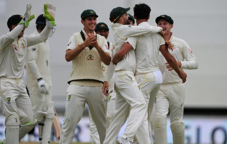 Mitchell Starc celebrates with teammates his dismissal of England's James Vince on day four of the third Test