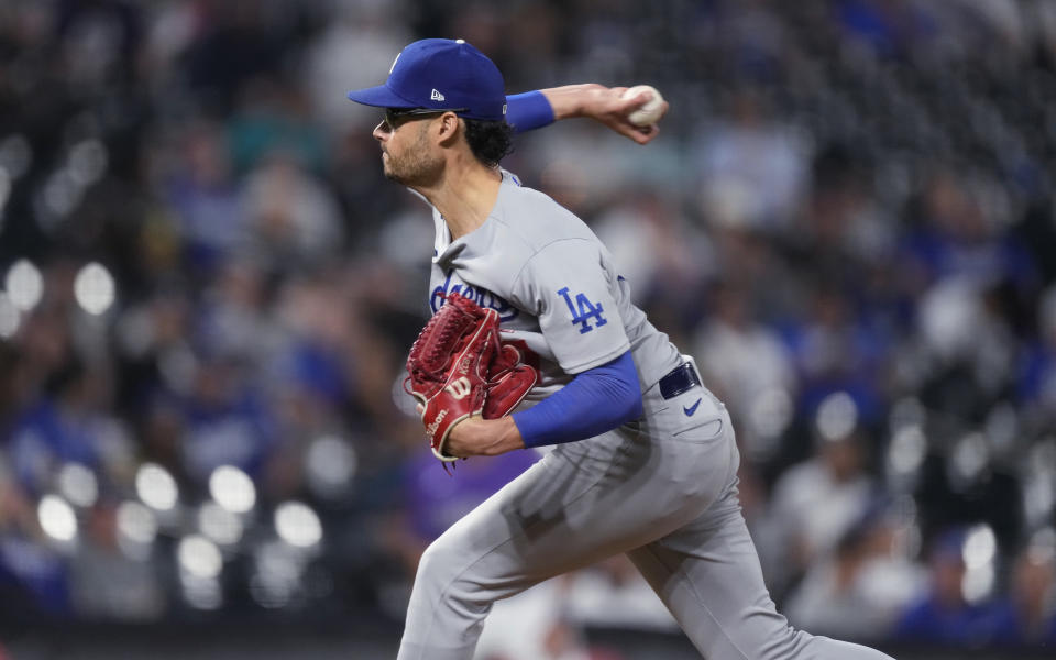 Los Angeles Dodgers relief pitcher Joe Kelly works against the Colorado Rockies during the eighth inning of the second game of a baseball doubleheader Tuesday, Sept. 26, 2023, in Denver. (AP Photo/David Zalubowski)