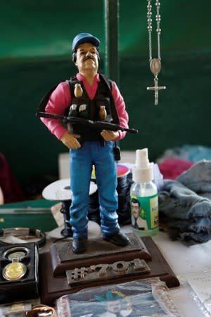 A statue depicting Mexican drug lord Joaquin "El Chapo" Guzman is pictured at a stall outside the "Saint Jesus Malverde" chapel in Culiacan