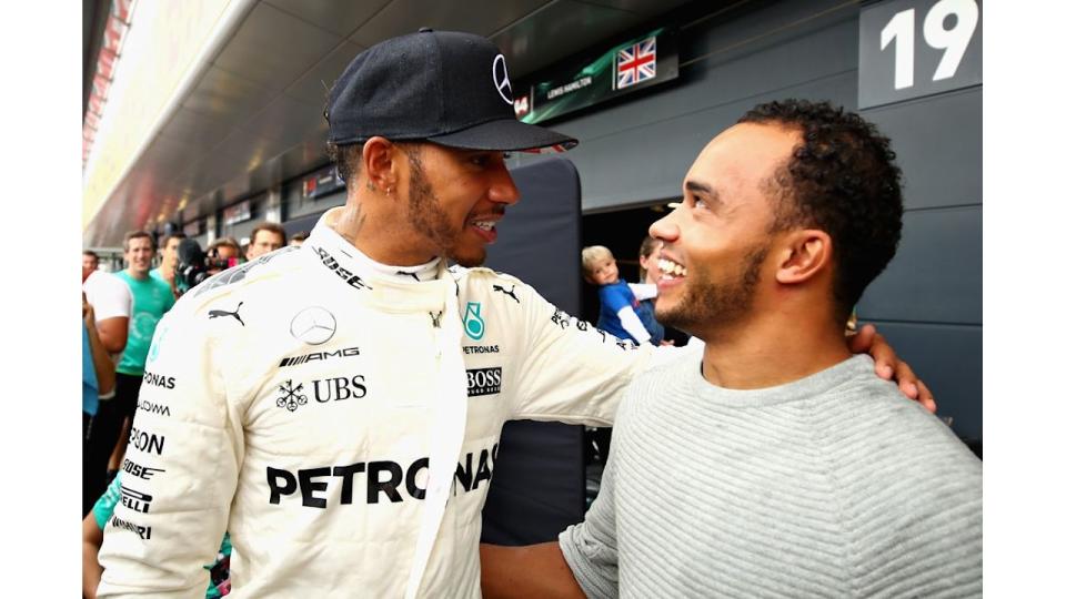 Lewis Hamilton with his arm around Nicolas Hamilton