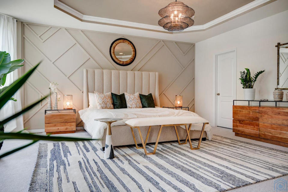 A geometric wall installation creates a dynamic aesthetic in this bedroom by Noel Benitez