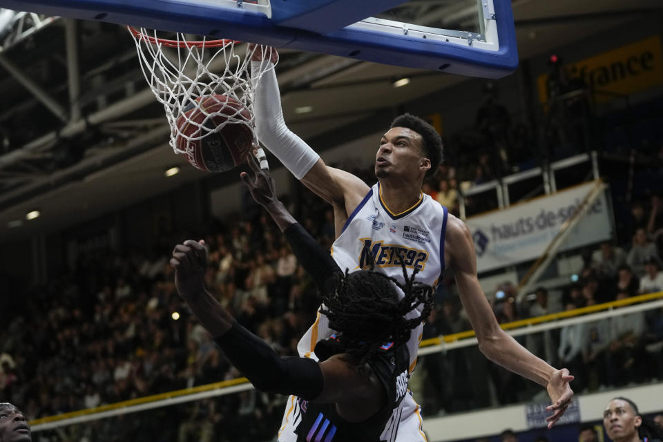 Boulogne-Levallois' Victor Wembanyama dunks during the Elite basketball match Boulogne-Levallois against Paris at the Palais de Sports Marcel Cerdan stadium in Levallois-Perret, outside Paris, Tuesday, May 16, 2023. Wembanyam is projected to be the first overall pick in the 2023 NBA draft. (AP Photo/Thibault Camus)