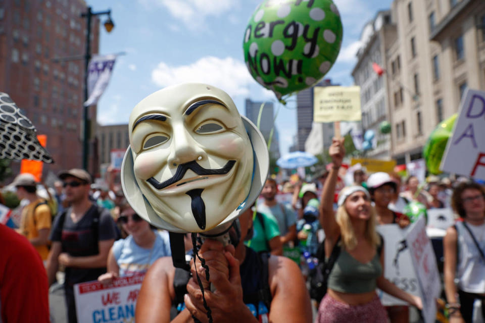 <p>A protestor chants through a megaphone as he marches during a demonstration in downtown on Sunday, July 24, 2016, in Philadelphia. The Democratic National Convention starts Monday. (AP Photo/John Minchillo)</p>