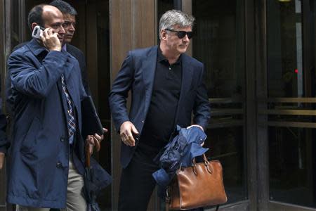 Actor Alec Baldwin (R) departs after testifying in the trial against Genevieve Sabourin at Manhattan Criminal court in New York, November 12, 2013. REUTERS/Lucas Jackson