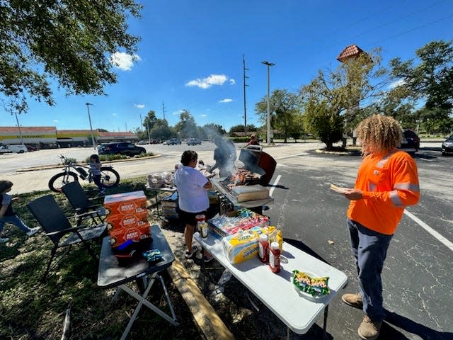 The nonprofit Deltona Strong set up a small cookout on Friday, Sept. 30, so that residents without power could get a warm meal for free. Dana McCool, a city commissioner, volunteered by manning the grill.