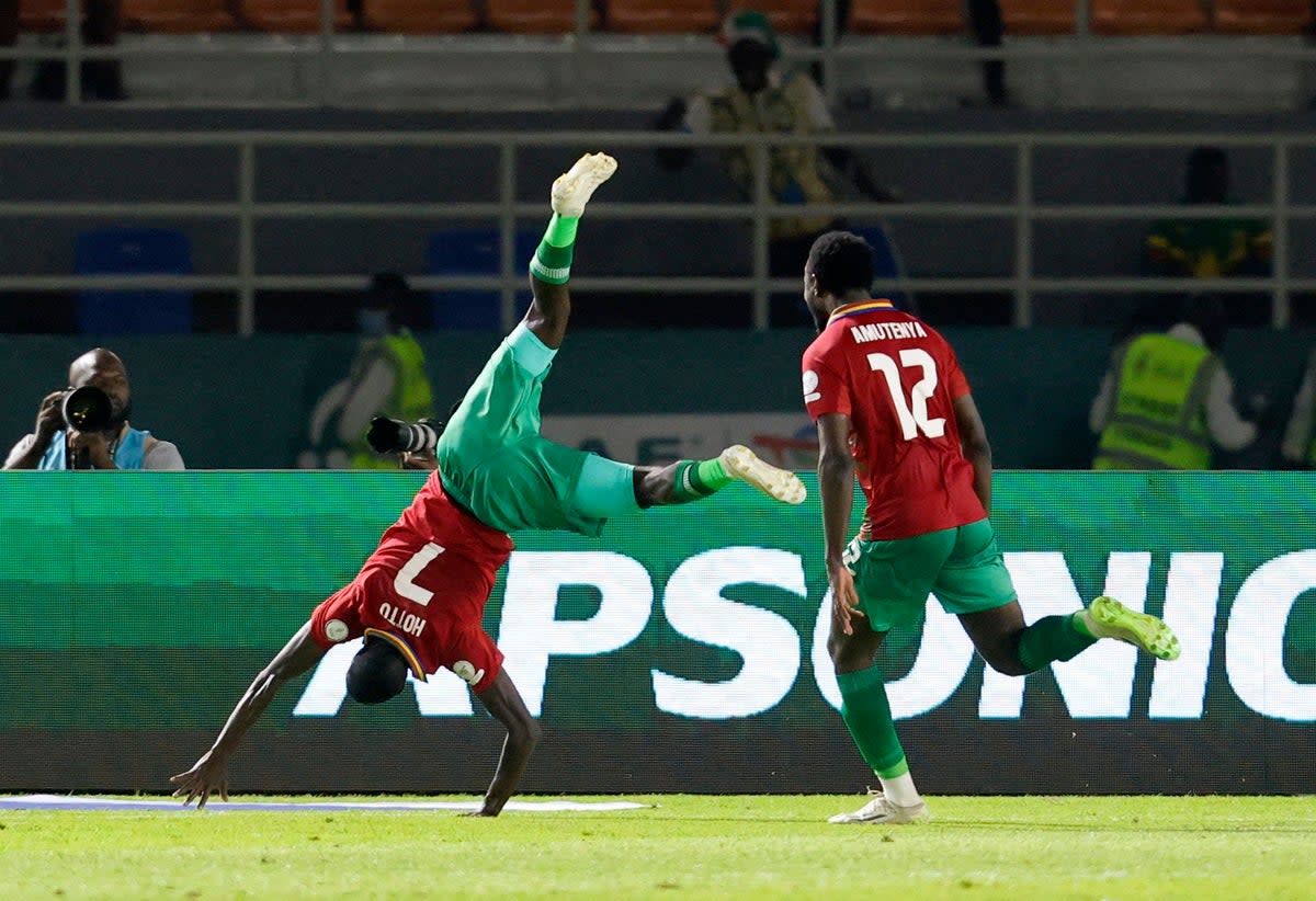 Celebration: Deon Hotto scored a historic late winner for Namibia against Tunisia (REUTERS)