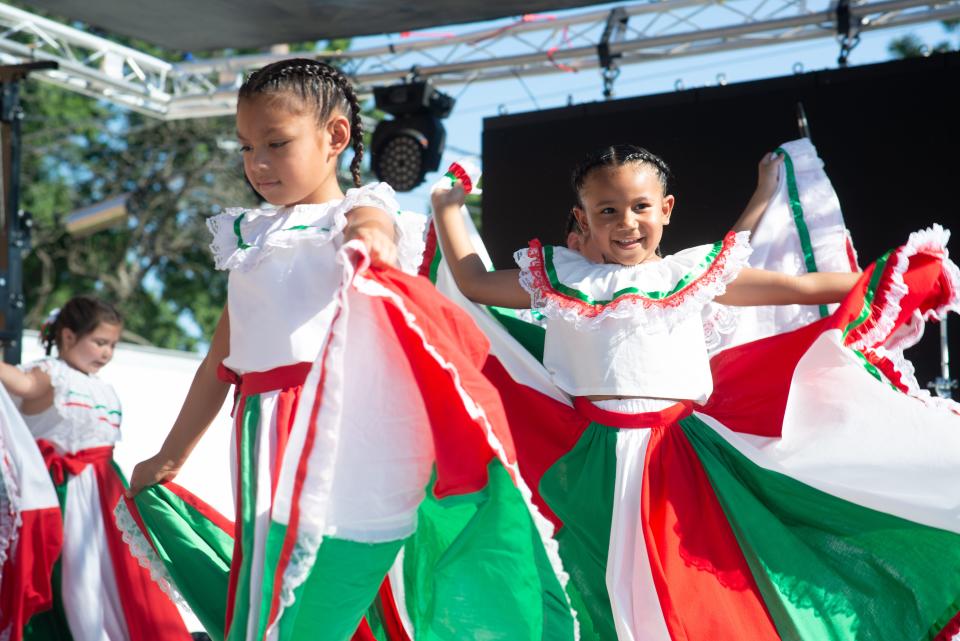 Our Lady of Guadalupe fiesta dancers perform Thursday in front of crowds gathered at the Fiesta Mexicana.