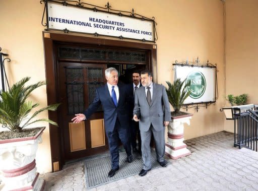 US Secretary of Defense Chuck Hagel (L) walks from a meeting with Afghanistan's Defence Minister Bismallah Khan Mohammadi (R) at the International Security Assistance Force headquartersin Kabul on March 10, 2013. Hagel's first trip to Afghanistan was overshadowed on Sunday by a contentious speech by President Hamid Karzai and a security scare that forced their press conference to be cancelled