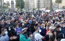 Demonstrators gather during a protest against the fall in Lebanese pound currency and mounting economic hardships, in Sidon