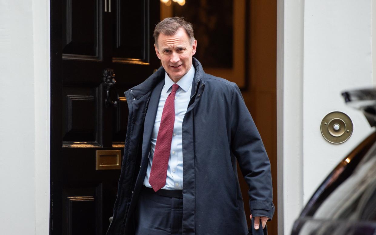 Jeremy Hunt, the Chancellor, is pictured this morning leaving 11 Downing Street