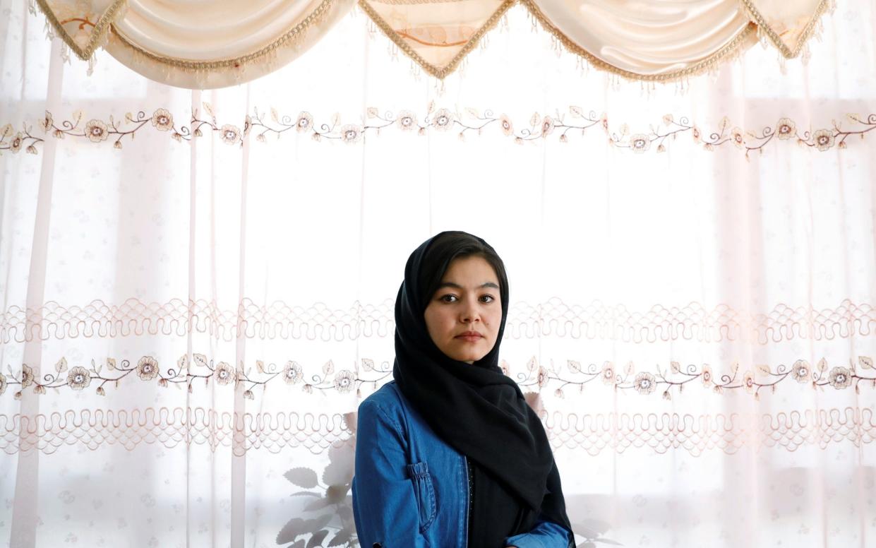 Shamsia Alizada,18, who came top in the country's university entrance exam, at her home in Kabul, Afghanistan - Reuters