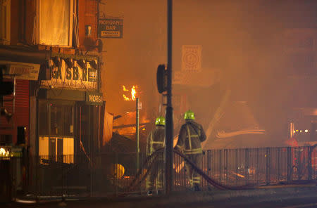 Members of the emergency services work at the site of an explosion which destroyed a convenience store and a home in Leicester, Britain, February 25, 2018. REUTERS/Darren Staples