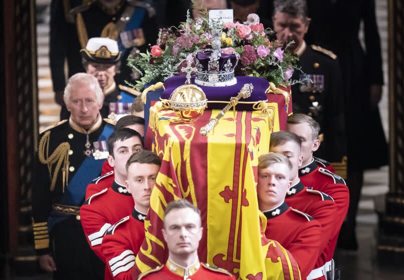 LONDON, ENGLAND - SEPTEMBER 19: King Charles III follows behind the coffin of Queen Elizabeth II, draped in the Royal Standard with the Imperial State Crown and the Sovereign's orb and sceptre, as it is carried out of Westminster Abbey. after the State Funeral of Queen Elizabeth II on September 19, 2022 in London, England. Elizabeth Alexandra Mary Windsor was born in Bruton Street, Mayfair, London on 21 April 1926. She married Prince Philip in 1947 and ascended the throne of the United Kingdom and Commonwealth on 6 February 1952 after the death of her Father, King George VI. Queen Elizabeth II died at Balmoral Castle in Scotland on September 8, 2022, and is succeeded by her eldest son, King Charles III. (Photo by Danny Lawson - WPA Pool/Getty Images)