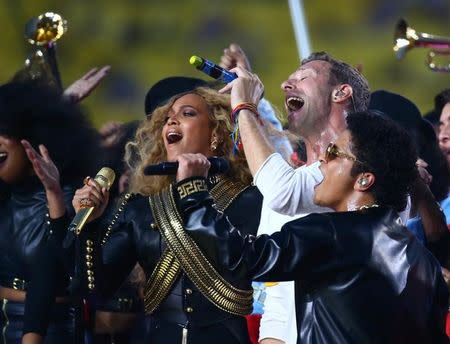 Feb 7, 2016; Santa Clara, CA, USA; Recording artists from left Beyonce , Chris Martin of Coldplay and Bruno Mars perform at halftime in Super Bowl 50 between the Carolina Panthers and the Denver Broncos at Levi's Stadium. Mandatory Credit: Mark J. Rebilas-USA TODAY Sports