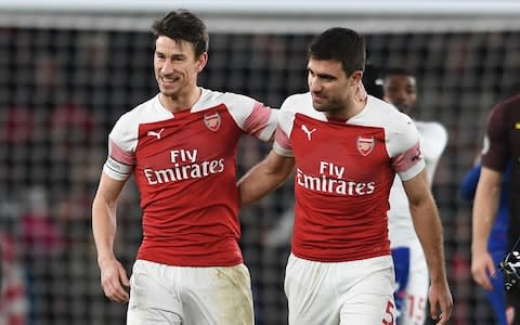 Laurent Koscielny and Sokratis celebrate Arsenal's win  - Credit: Getty images