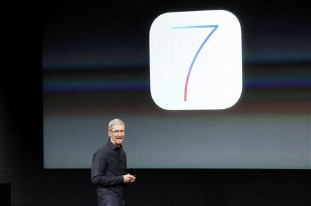 Apple Inc CEO Tim Cook speaks about the new iOS7 software during Apple Inc's media event in Cupertino, California September 10, 2013. REUTERS/Stephen Lam