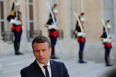 FILE PHOTO: French President Emmanuel Macron attends a meeting at the Elysee Palace in Paris, France May 21, 2017. REUTERS/Philippe Wojazer