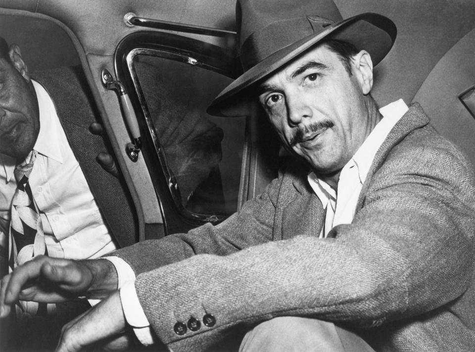 Howard Hughes seated in an automobile in 1940.