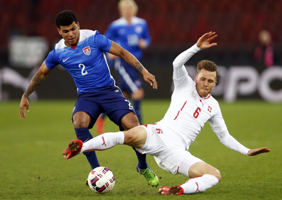 Widmer of Switzerland fights for the ball with Yedlin of the U.S during their international friendly soccer match at the Letzigrund Stadium in Zurich