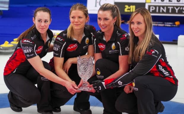 Ottawa's Rachel Homan, right, and rink pose with the Humpty's Championship Cup after defeating Switzerland's Silvana Tirinzoni 6-3 in the final on Monday. (Mike Cleasby/Grand Slam of Curling - image credit)