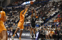 Connecticut's Crystal Dangerfield shoots over Tennessee's Jazmine Massengill in the first half of an NCAA college basketball game, Thursday, Jan. 23, 2020, in Hartford, Conn. (AP Photo/Jessica Hill)
