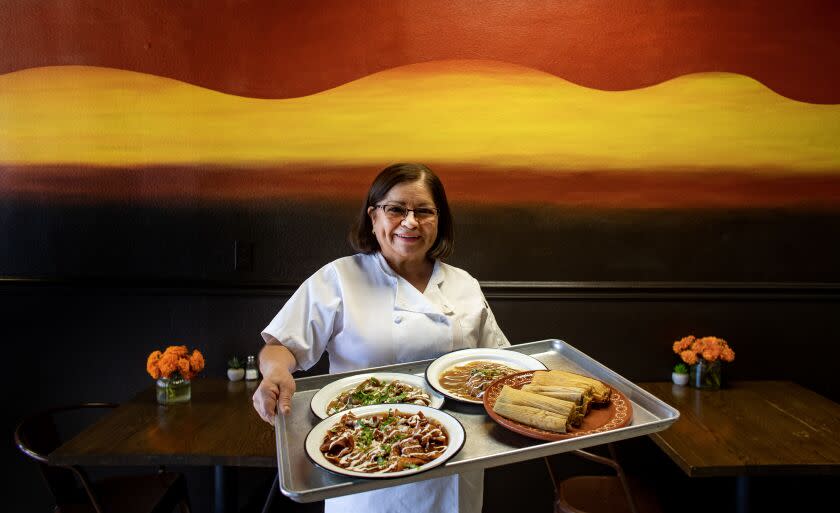 INDIO, CA - NOVEMBER 18, 2022: Silvia Rendon owner of Casa de Silvia restaurant shows off her Mexican dishes including her award winning tamales on November 18, 2022 in Indio, California. She has accumulated many trophies from the Indio Tamale Festival which is celebrating its 30th anniversary in early December. (Gina Ferazzi / Los Angeles Times)