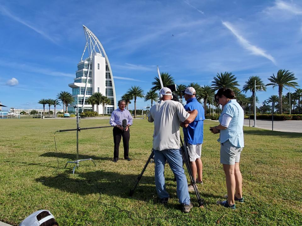 A crew interviews Port Canaveral Chief Executive Officer John Murray in 2021 in front of the port's Exploration Tower during the filming of an episode of the Discovery Channel's road trip series "RV There Yet?"