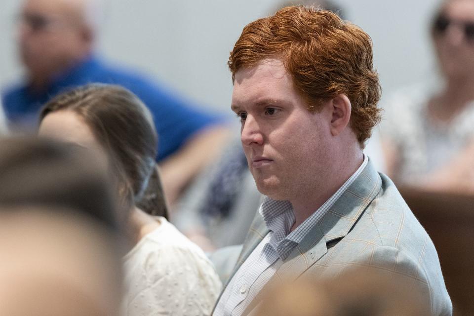 buster murdaugh sits in a courtroom listening to testimony