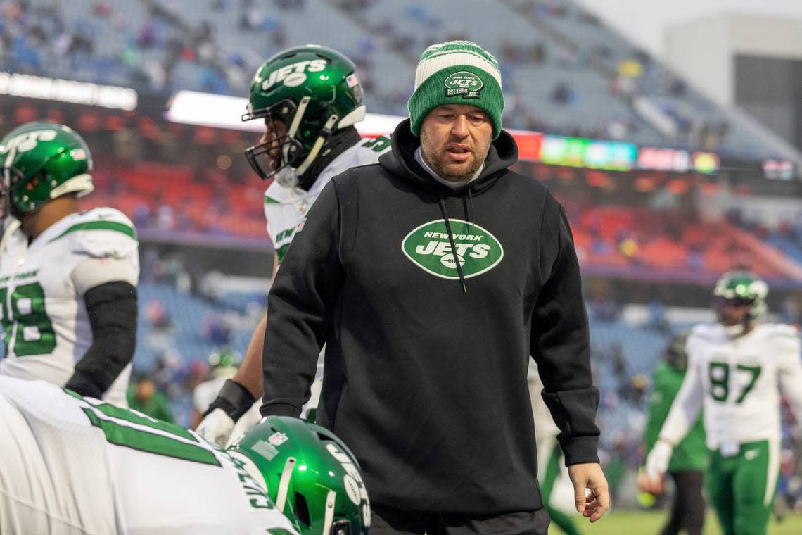 New York Jets defensive line coach Aaron Whitecotton coaches his players during warm ups before playing against the Buffalo Bills in an NFL football game, Sunday, Dec. 11, 2022, in Orchard Park, N.Y. Bills won 20-12. (AP Photo/Jeff Lewis)