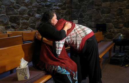 Undocumented Salvadoran immigrant Rosa Gutierrez Lopez is comforted by Rev. Katie Romano Griffin after an interview with Reuters in the Unitarian Universalist Church where she has been given sanctuary while pressing her case for asylum, in Bethesda, Maryland, U.S., January 2, 2019. REUTERS/Kevin Lamarque