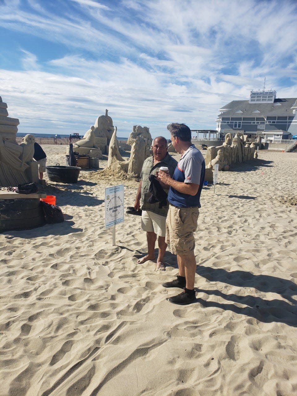 Taking home the Governor's Award, selected by Gov. Chris Sununu, and securing a spot in next year's contest was Greg Grady Jr. for his piece titled "Wyvern Whisperer" in the 2022 Hampton Beach Master Sand Sculpting Classic Saturday, June 18. Pictured is Hampton Beach Village District Commissioner Chuck Rage and Gov. Sununu.