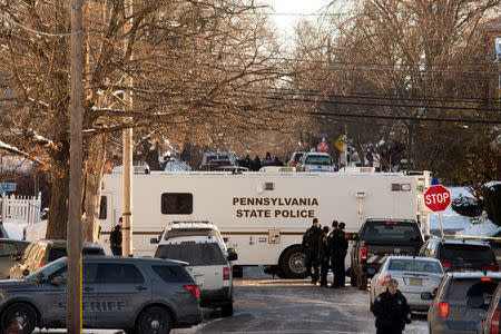 Pennsylvania State Police investigators block an intersection after officer-involved shooting in Harrisburg, Pennsylvania, U.S., January 18, 2018. REUTERS/Daniel Shanken