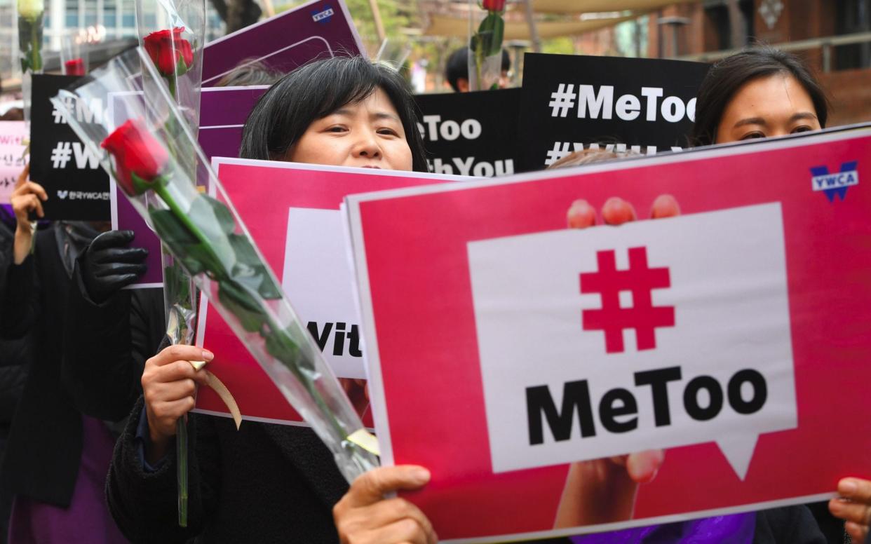 South Korean demonstrators hold banners during a rally to mark International Women's Day as part of the country's #MeToo movement  - AFP
