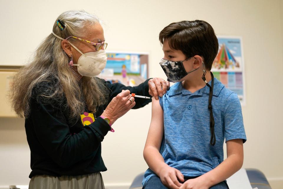 Dr. Kathy Merritt vaccinates 8-year-old Daniel McCullock with the Pfizer child COVID-19 vaccination at Chapel Hill Pediatrics and Adolescents in Chapel Hill, N.C.