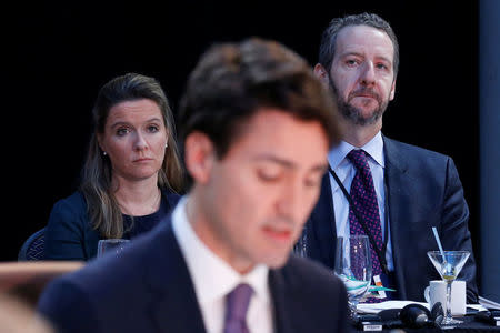 Canadian Prime Minister Justin Trudeau's chief of staff Katie Telford (L) and principal secretary Gerald Butts (R) listen as Trudeau (C) speaks during the First Ministers’ meeting in Ottawa, Ontario, Canada, December 9, 2016. REUTERS/Chris Wattie
