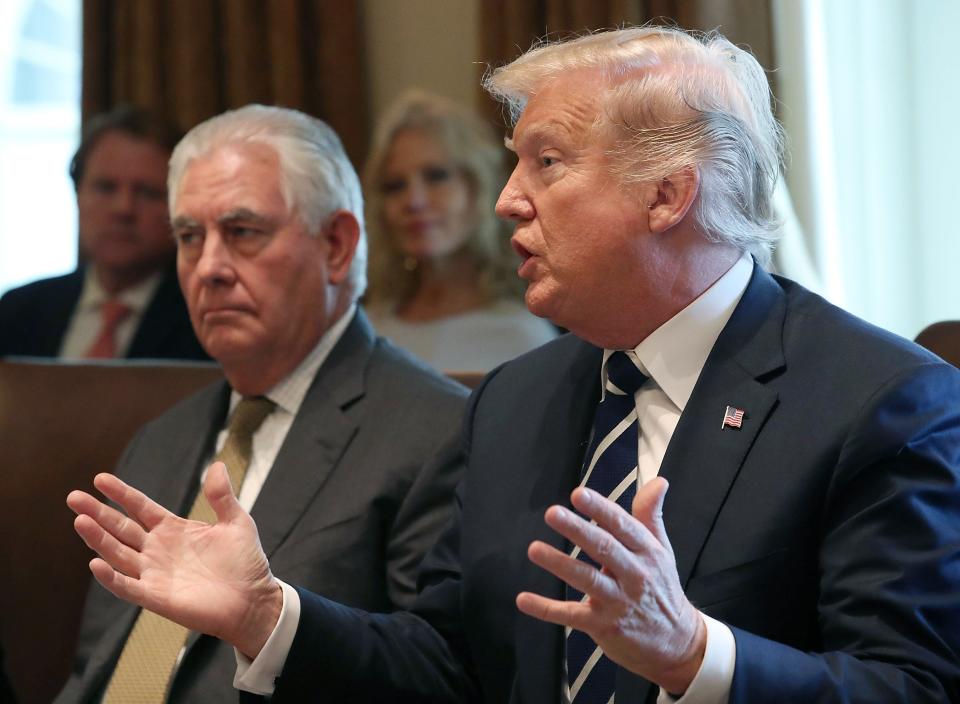 President Trump, right, joined by Secretary of State Rex Tillerson speaks to the media during a meeting with his Cabinet at the White House on Oct. 16, 2017 in Washington, D.C.