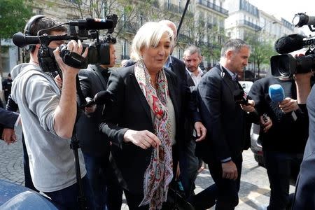 Marine Le Pen, French National Front (FN) political party leader and candidate for French 2017 presidential election, comes back from her haidresser in front of her campaign headquarters in Paris, France, April 24, 2017 the day after the first round of presidential elections where Le Pen ended in second place behind En Marche ! movement candidate. REUTERS/Charles Platiau