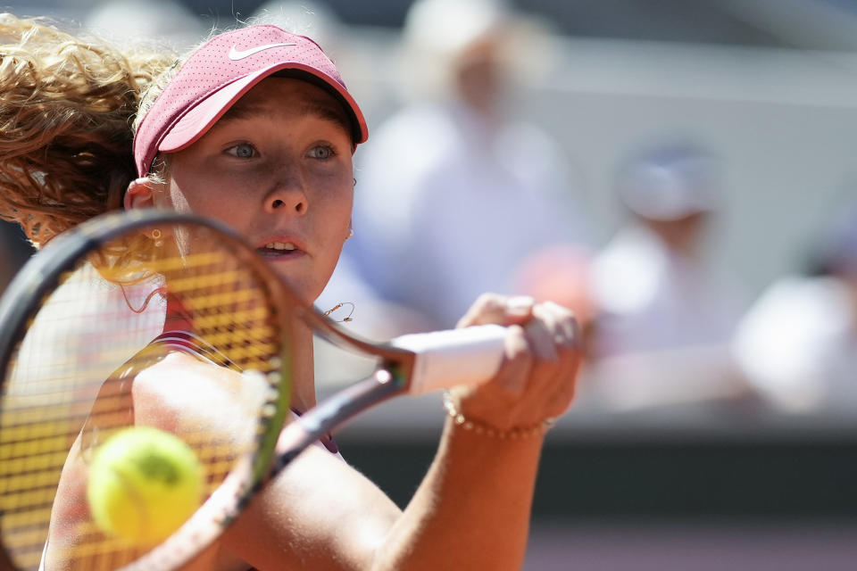 Russia's Mirra Andreeva plays a shot against Coco Gauff of the U.S. during their third round match of the French Open tennis tournament at the Roland Garros stadium in Paris, Saturday, June 3, 2023. (AP Photo/Christophe Ena)