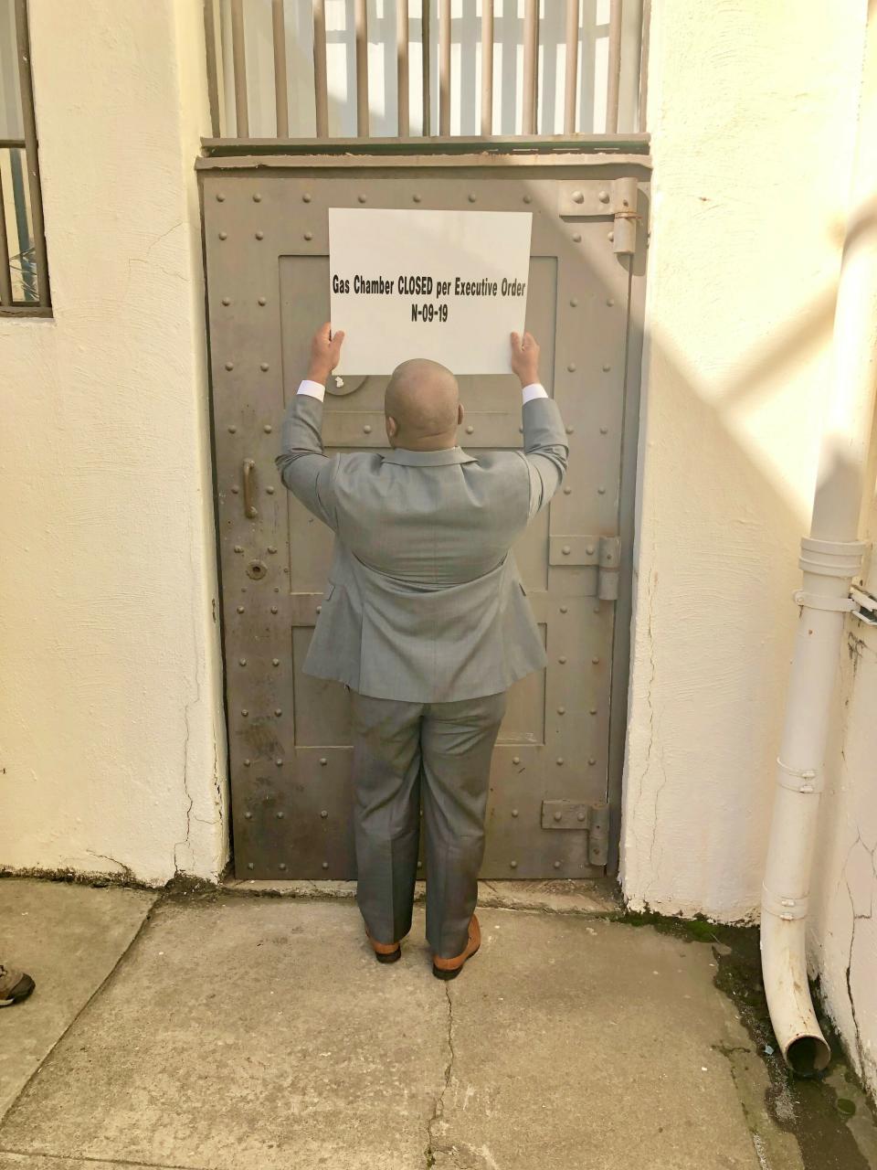 In this March 13, 2019, handout provided by the California Department of Corrections and Rehabilitation a closed sign is placed on the door leading to the gas chamber at San Quentin State Prison, in San Quentin, Calif. Gov. Gavin Newsom signed an executive order, Wednesday, placing a moratorium on the death penalty. (California Department of Corrections and Rehabilitation via AP)