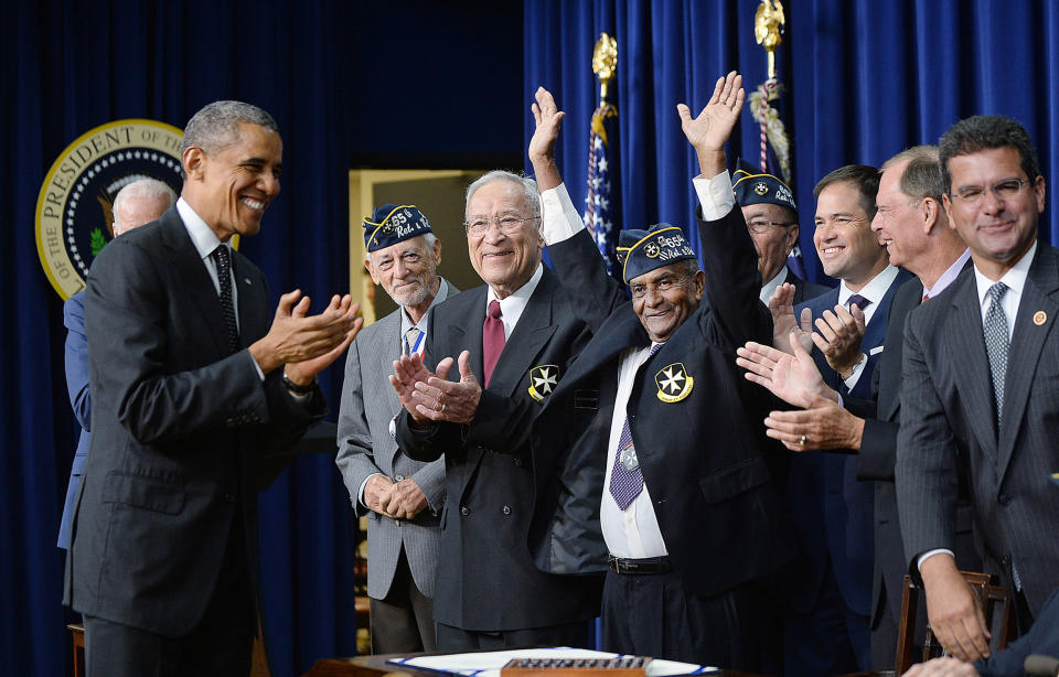 President Barack Obama with members of the 65th Infantry Regiment, known as the Borinqueneers,  (Olivier Douliery / Corbis/VCG via Getty Images)