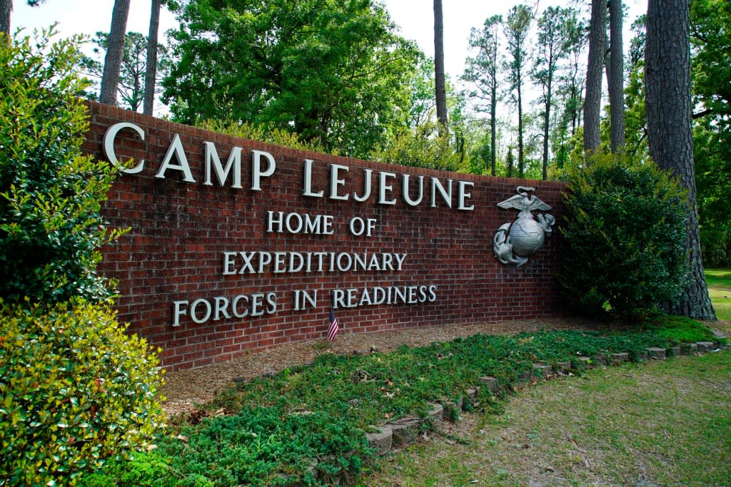 Signage stands on the main gate to Camp Lejeune Marine Base on April 29, 2022, outside Jacksonville, N.C. (Photo by Allen G. Breed, AP, File)