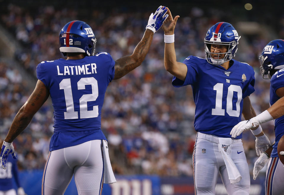 New York Giants quarterback Eli Manning (10) celebrates with wide receiver Cody Latimer (12) after a touchdown against the Chicago Bears during the first quarter of a pre-season NFL football game, Friday, Aug. 16, 2019, in East Rutherford, N.J. (AP Photo/Adam Hunger)