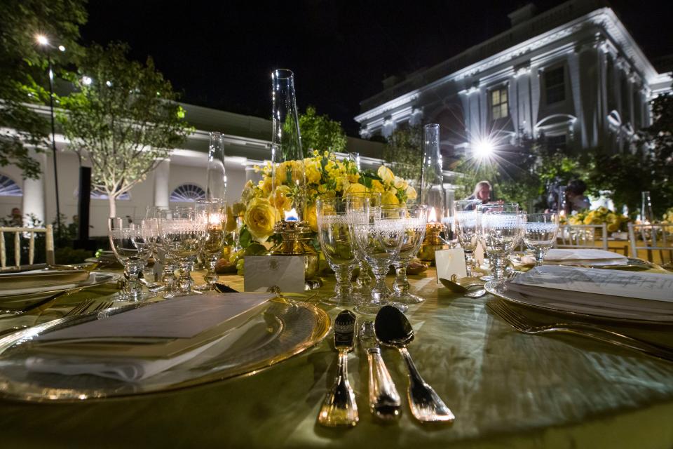 A table is set during a media preview for the State Dinner with President Donald Trump and Australian Prime Minister Scott Morrison in the Rose Garden of the White House, Thursday, Sept. 19, 2019.