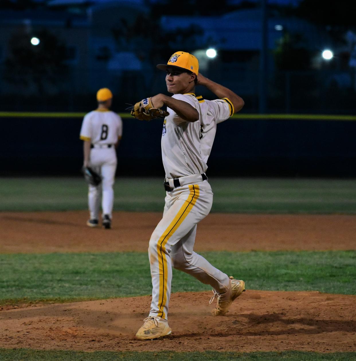 Boca Raton's Zach Stefan hurls a warm-up pitch before the seventh inning of Tuesday's regular season game against Suncoast on April 23, 2024.